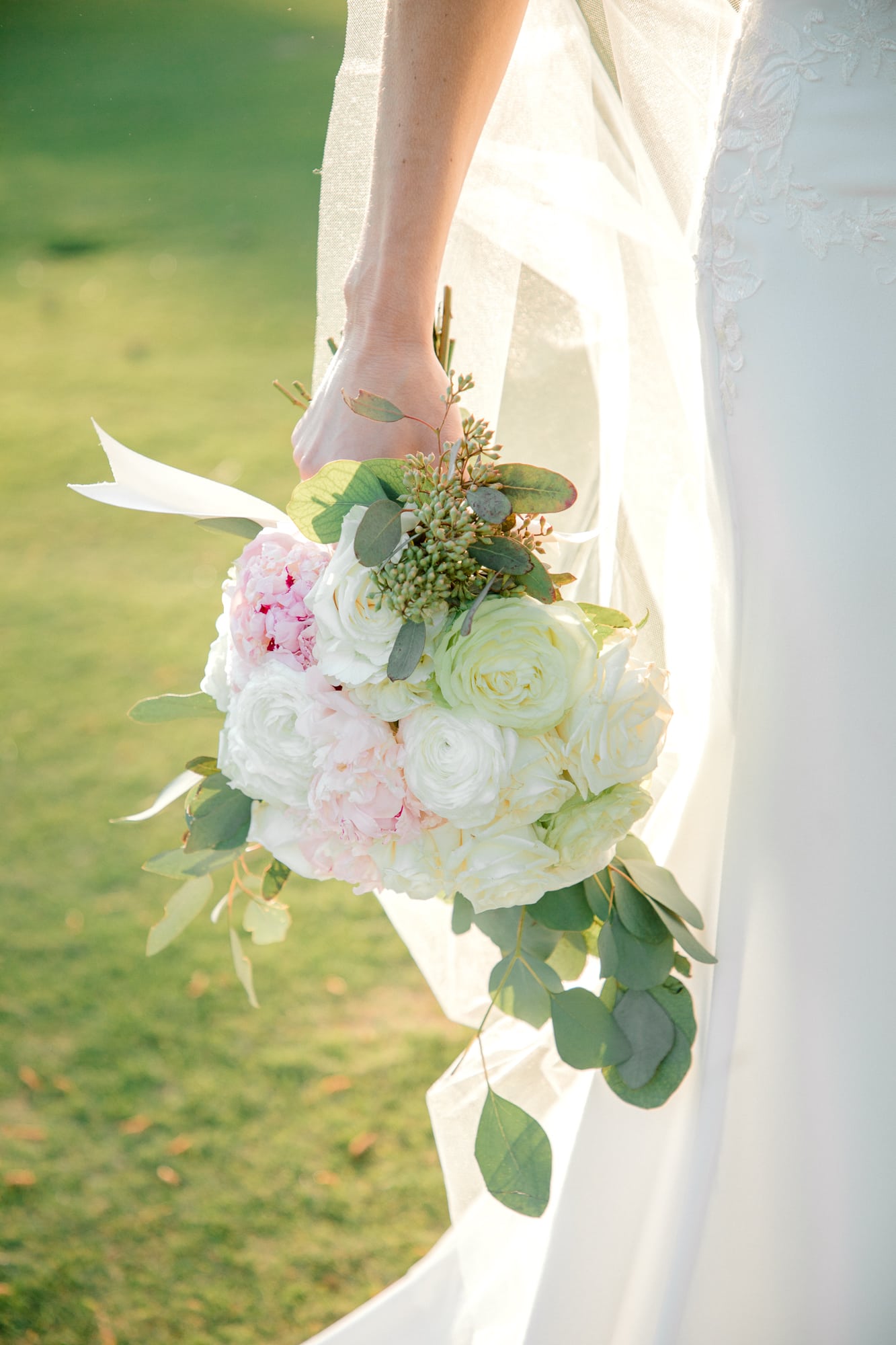 Bride holding bouquet close up