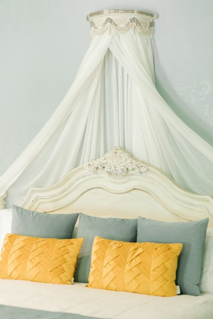 Isom Place bedroom with bed canopy
