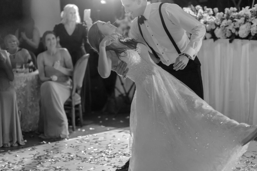 Groom dipping bride during first dance at The Lyric
