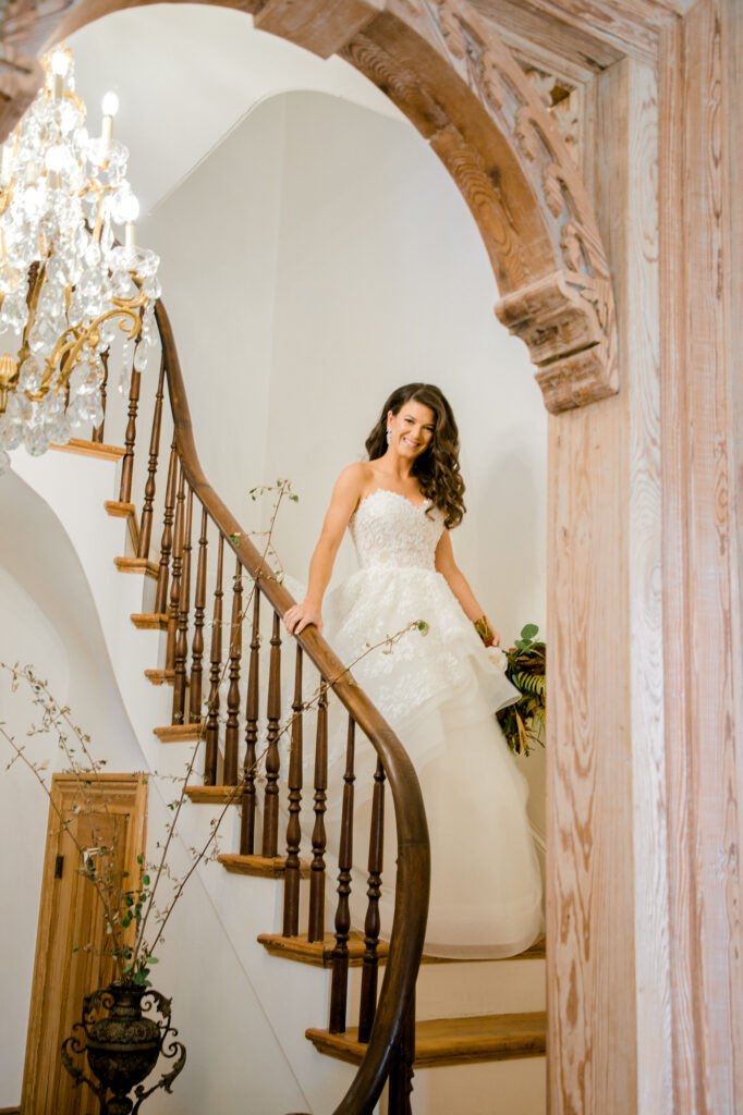 Bride walking down stairs at Simmons House