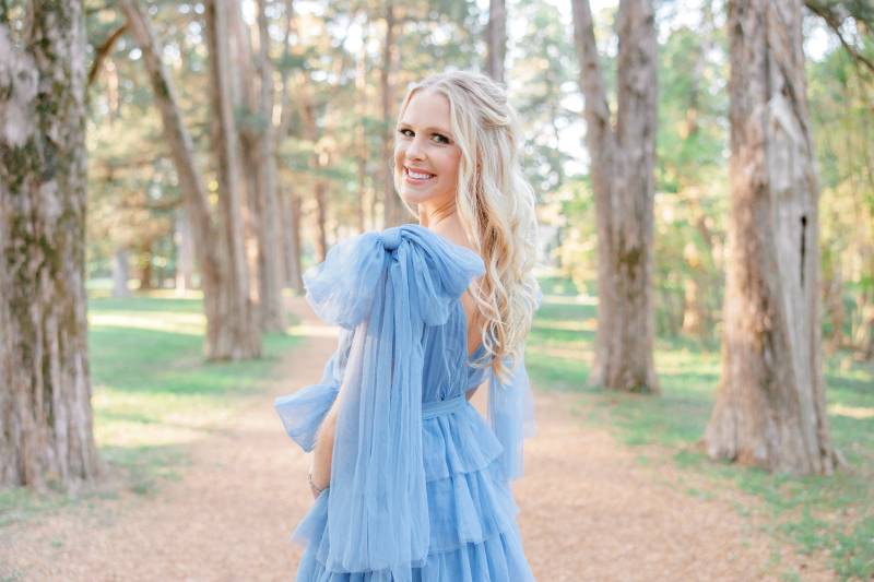 Senior photographer at Rowan Oak in Oxford, MS, posing in a picturesque setting